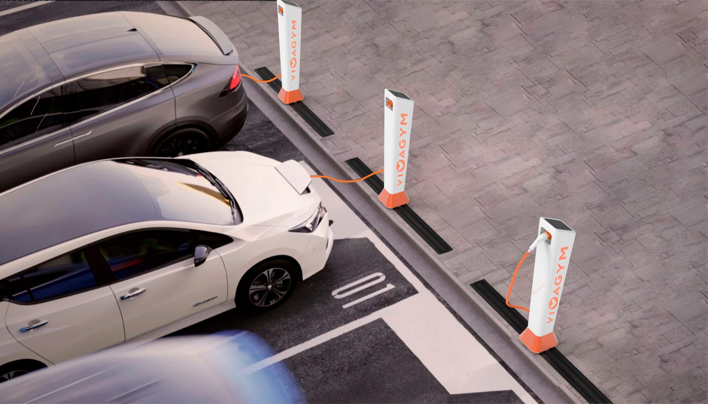 Dos cotxes elèctrics carregant en un aparcament amb carregadors VivaGym